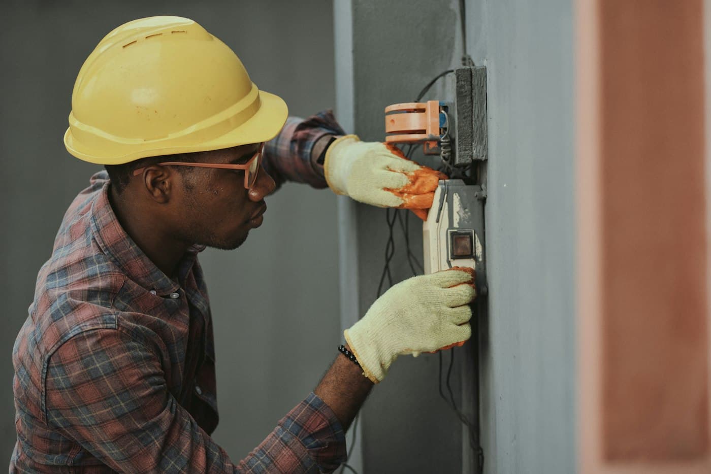 Electrician testing an electricity meter