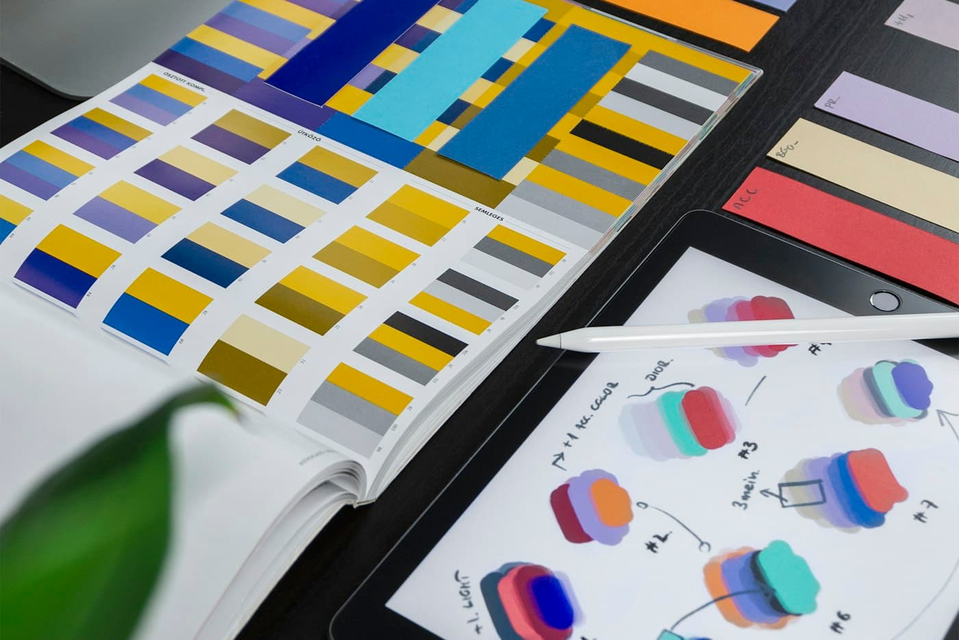 Colour swatches and a tablet with design sketches