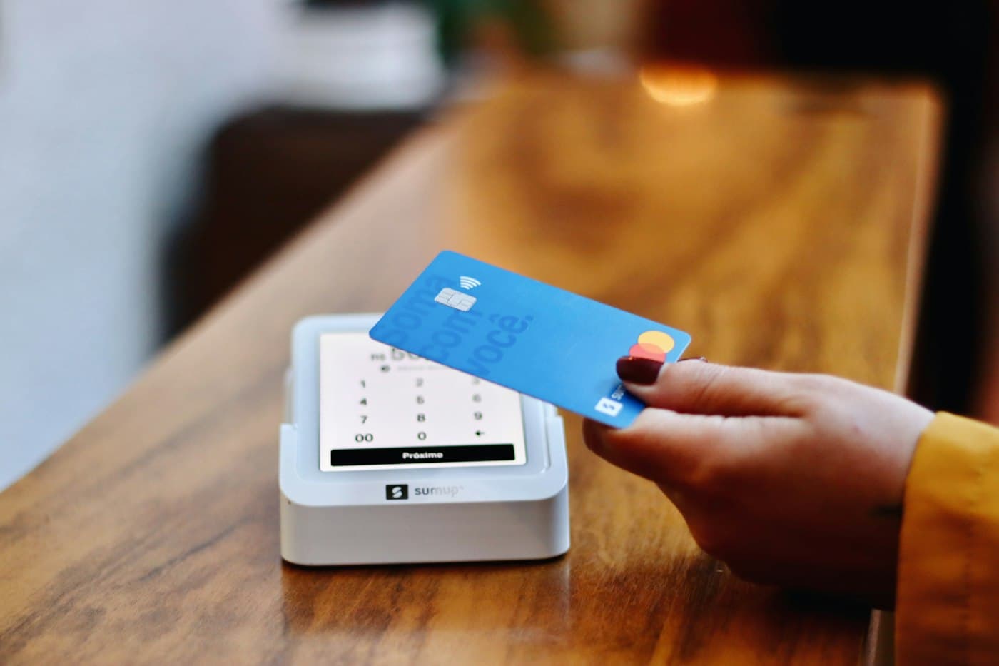 Contactless card tapped on a countertop card machine