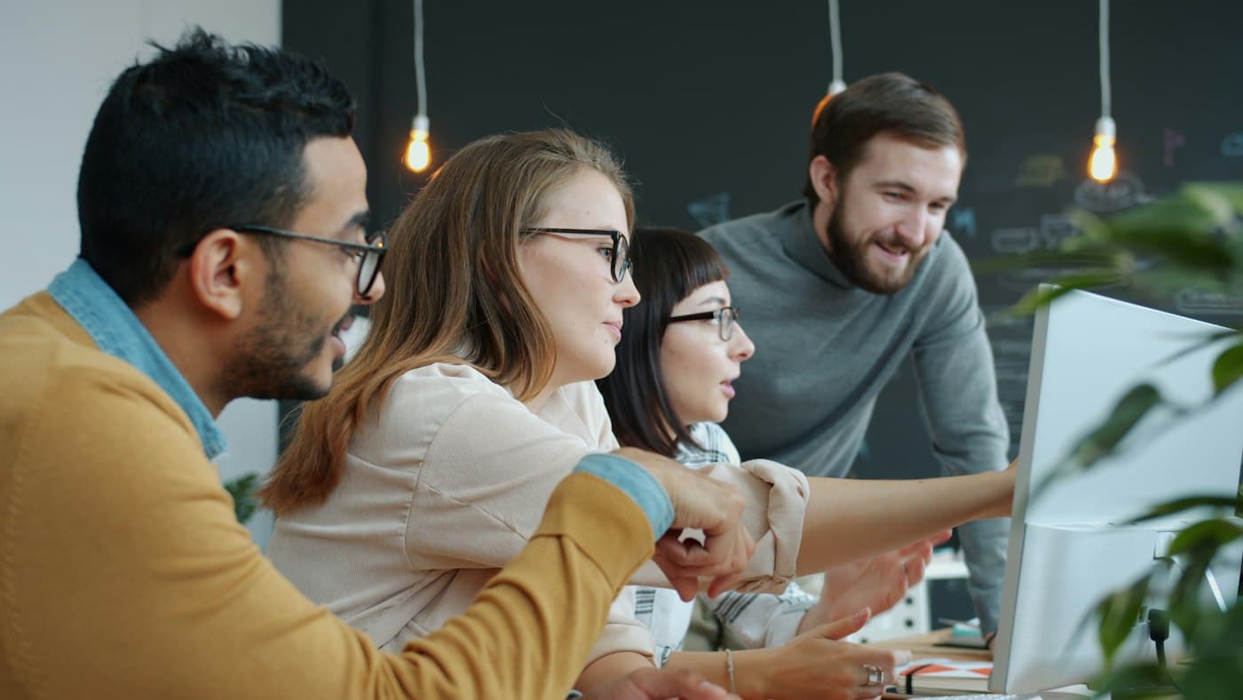 Digital team working together at a computer